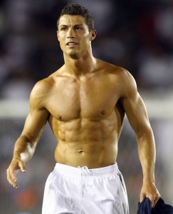 Cristiano Ronaldo removes his Real Madrid soccer jersey in Pasadena, CA.